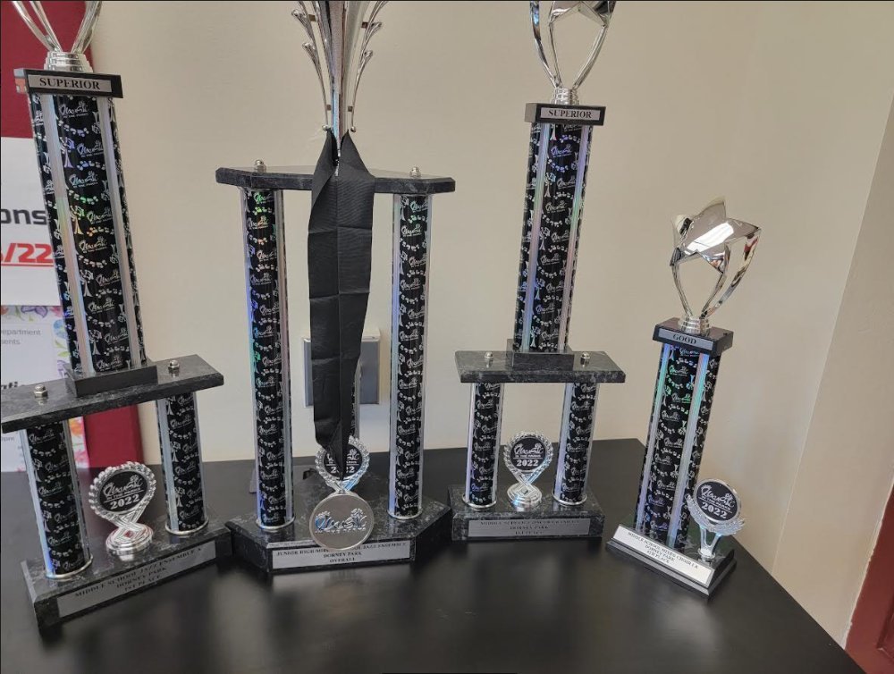 4 trophies of varying heights