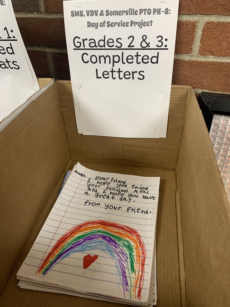 letter written by a child with a rainbow and heart on it